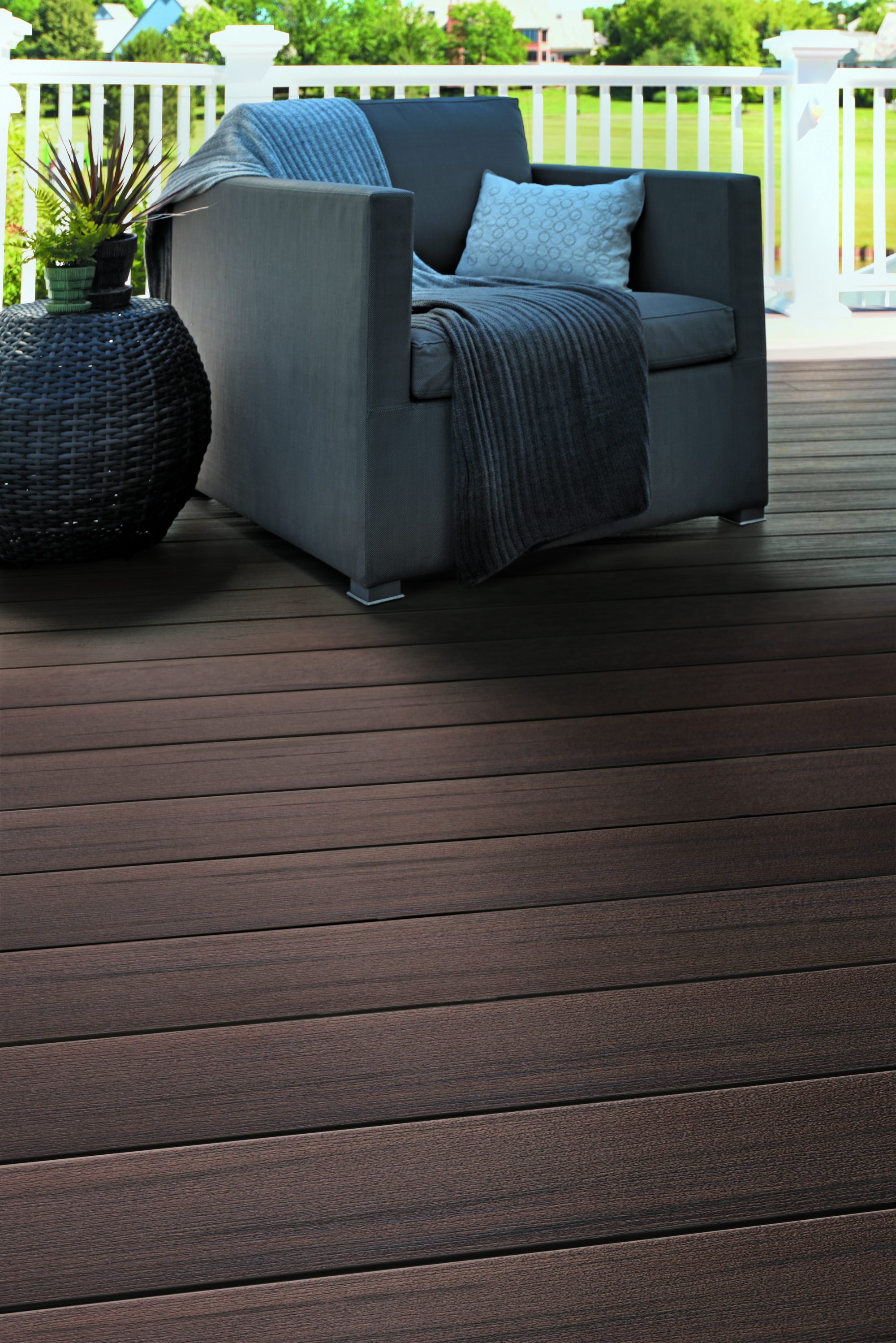 Outdoor furniture on a TimberTech Prime+ composite deck in Dark Cocoa